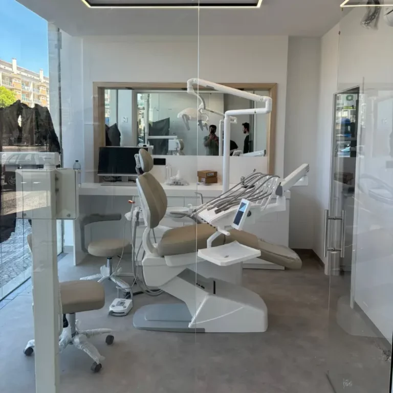 Modern dental treatment chair in a bright clinic with overhead light and dental instruments ready for a procedure